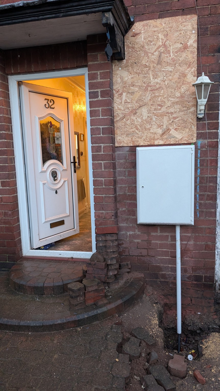 New surface-mounted meter box beside the front door